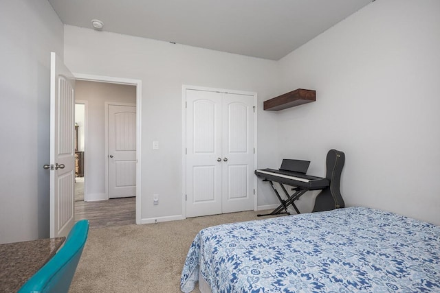 bedroom featuring a closet and carpet flooring