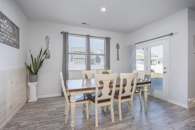 dining room with wood-type flooring