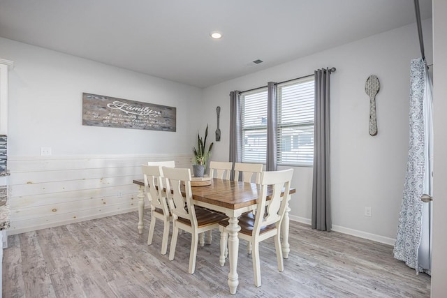 dining room featuring light hardwood / wood-style flooring