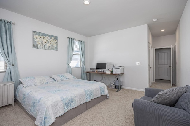 bedroom featuring radiator and light carpet