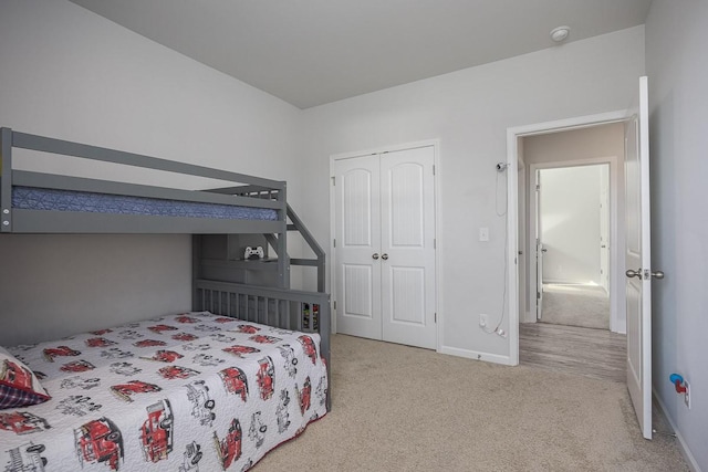 carpeted bedroom featuring a closet