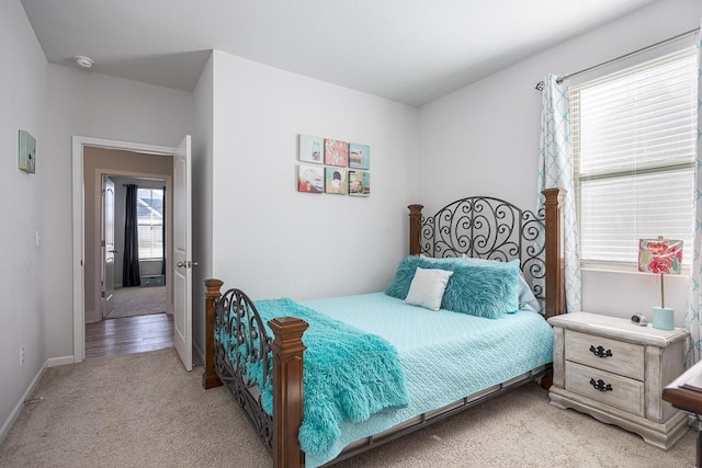 bedroom featuring light colored carpet