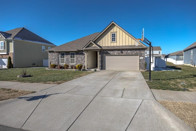 view of front of home featuring a garage and a front yard