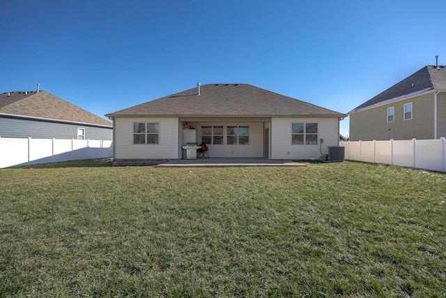 rear view of property featuring a patio, a lawn, and central air condition unit