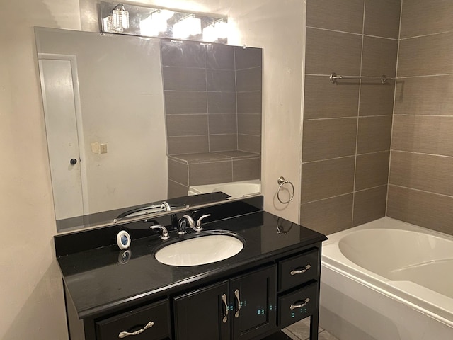 bathroom featuring vanity and a washtub