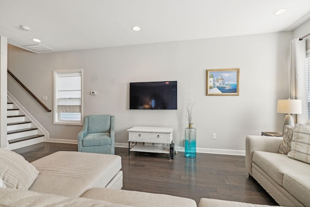 living room featuring dark hardwood / wood-style flooring