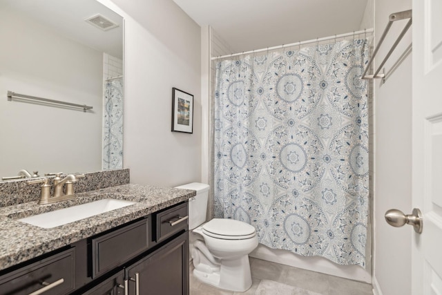 bathroom featuring toilet, vanity, and walk in shower