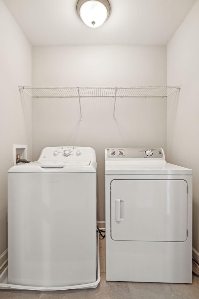 laundry room featuring washing machine and dryer