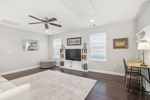 living room with ceiling fan and dark hardwood / wood-style floors