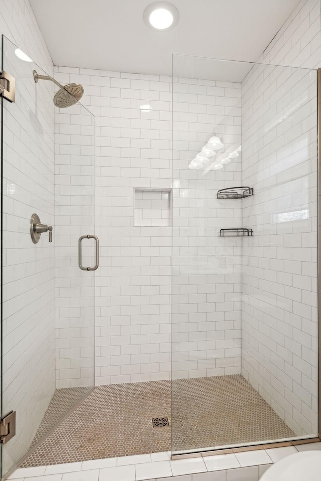 bathroom featuring walk in shower