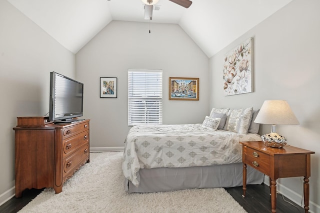 bedroom featuring ceiling fan, hardwood / wood-style flooring, and lofted ceiling