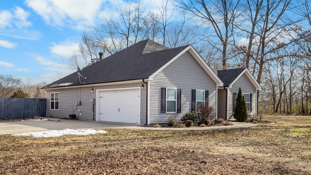 view of side of home featuring a garage