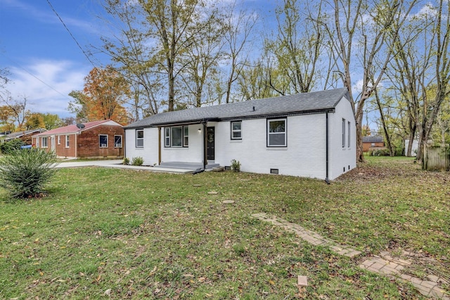 ranch-style house with a front lawn