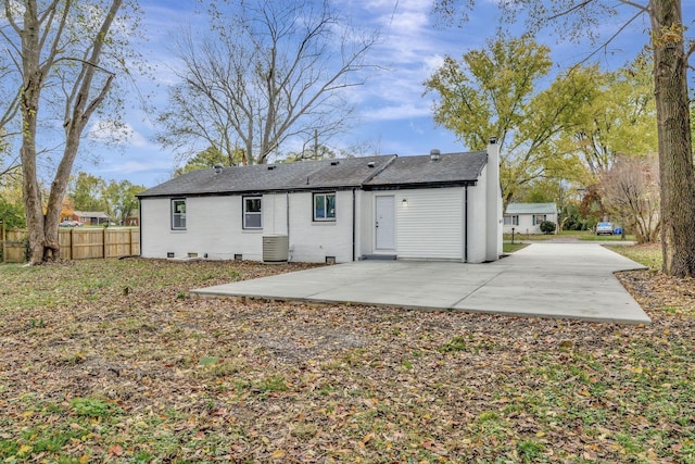 rear view of house with a patio area and central air condition unit