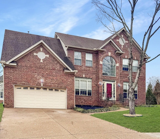 view of front facade featuring a garage and a front lawn