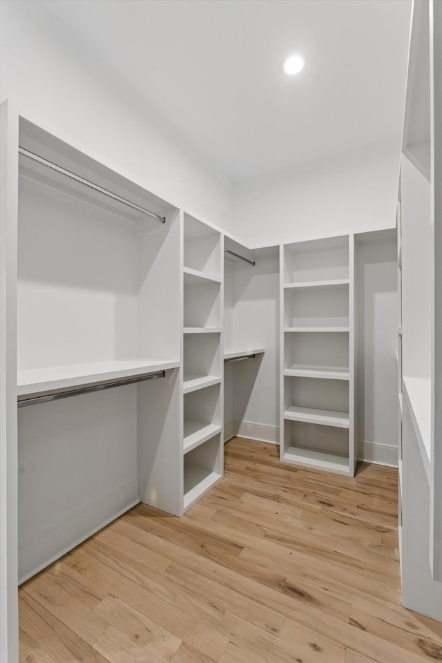 walk in closet featuring light wood-type flooring