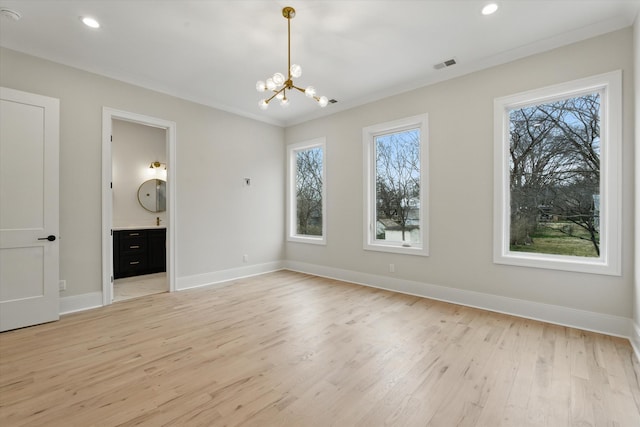 unfurnished dining area with baseboards, visible vents, light wood-style flooring, recessed lighting, and a chandelier