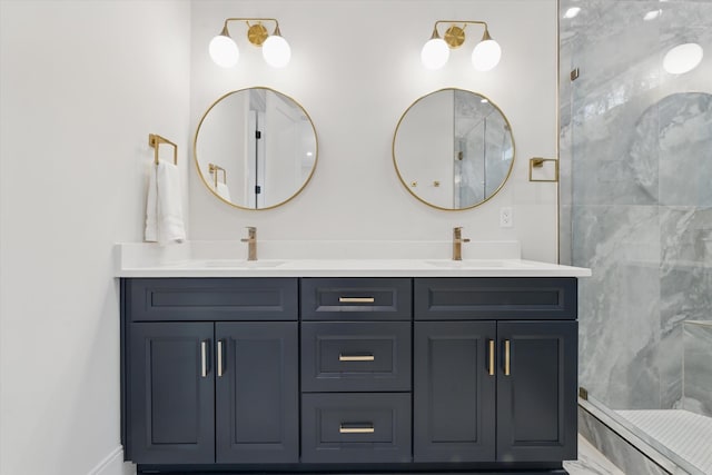 bathroom featuring double vanity, baseboards, a tile shower, and a sink