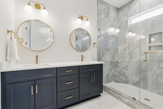 full bathroom featuring a sink, marble finish floor, and a shower stall