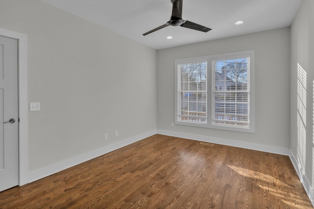 unfurnished room featuring ceiling fan and wood-type flooring