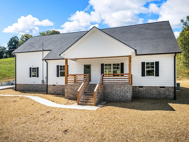 modern inspired farmhouse with a porch