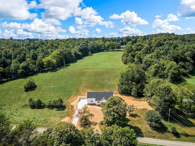 birds eye view of property with a rural view