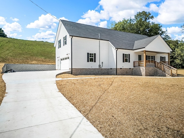 view of front facade featuring a garage and covered porch