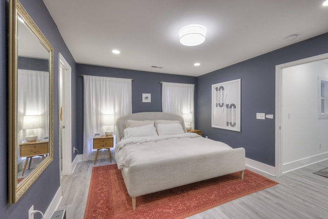 bedroom with light wood-type flooring