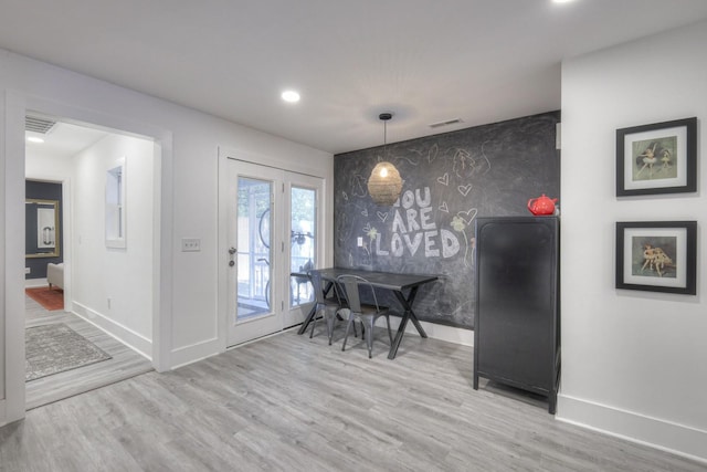 dining room with light hardwood / wood-style flooring