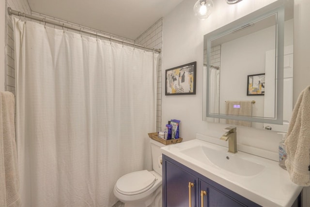 bathroom with toilet, vanity, and a shower with shower curtain