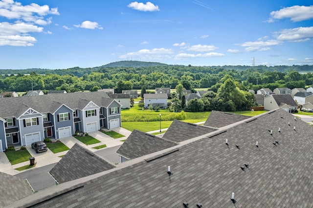 bird's eye view featuring a residential view and a view of trees