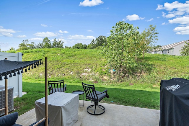 view of patio featuring central AC and grilling area