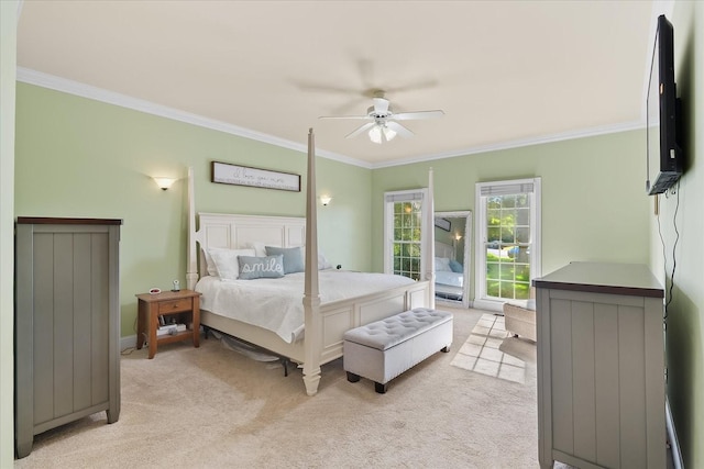 bedroom featuring ceiling fan, light colored carpet, and ornamental molding