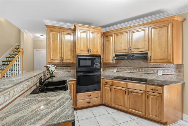 kitchen featuring light tile patterned floors, black appliances, backsplash, crown molding, and sink