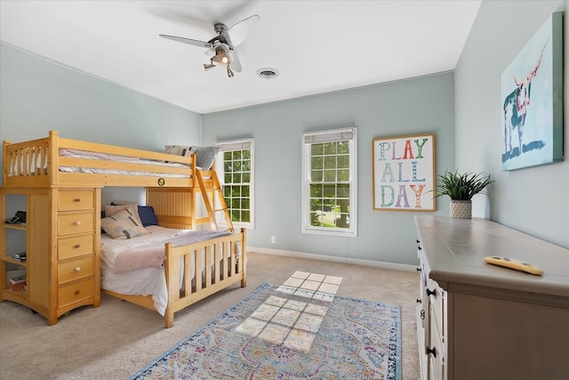 bedroom featuring ceiling fan and light carpet