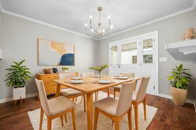 dining space with a chandelier, wood finished floors, and ornamental molding