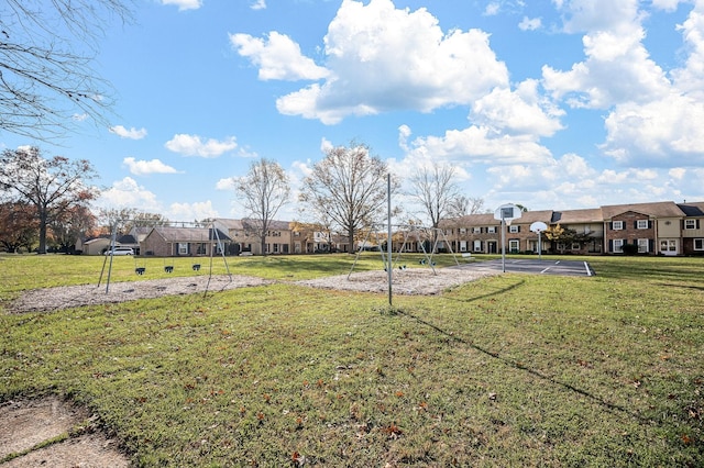 view of yard featuring community basketball court and a residential view