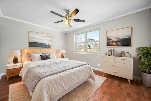 bedroom with dark wood-style floors, crown molding, baseboards, and ceiling fan