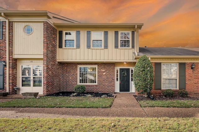 townhome / multi-family property with brick siding