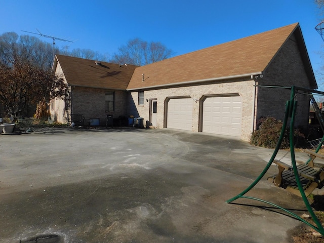 view of side of home with a garage