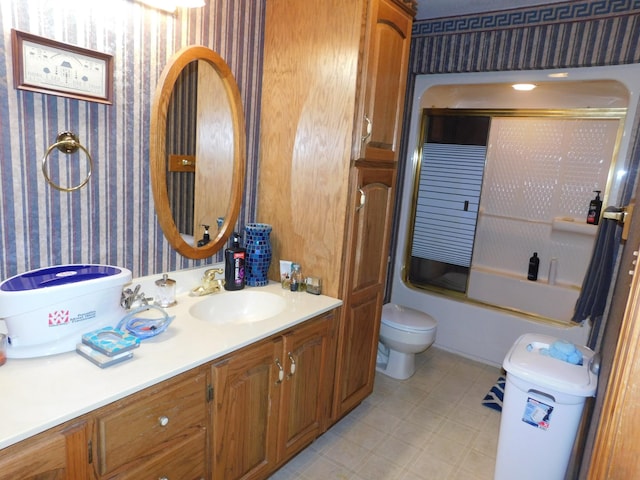 full bathroom with vanity, toilet, and enclosed tub / shower combo