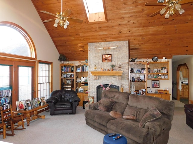 carpeted living room featuring a fireplace, wooden ceiling, high vaulted ceiling, and ceiling fan