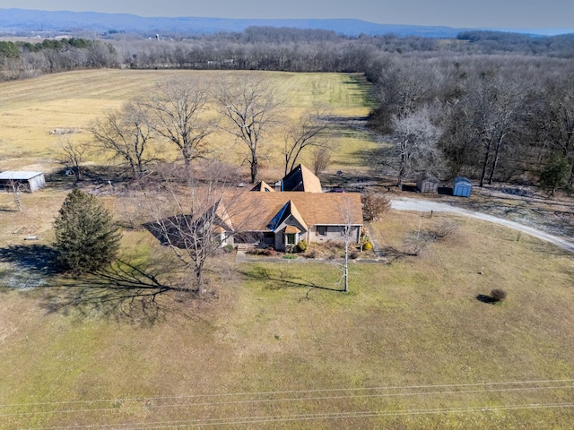 birds eye view of property with a mountain view and a rural view