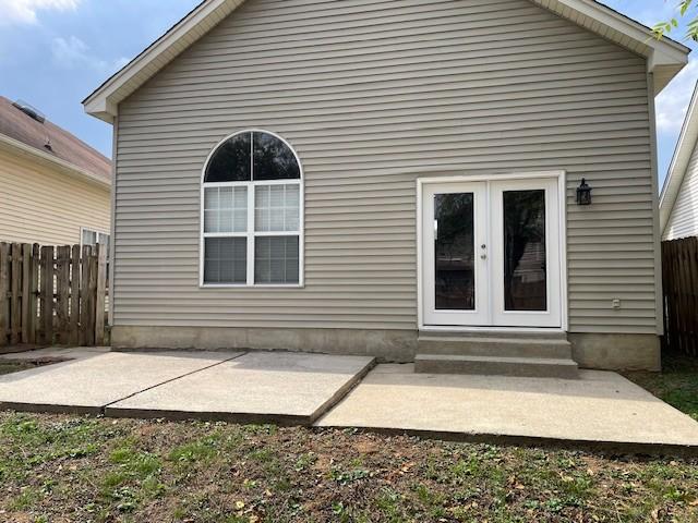 rear view of house with french doors and a patio area