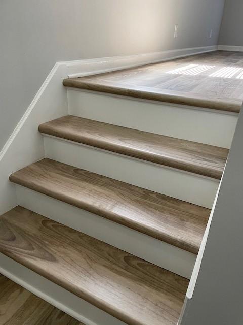 stairway featuring hardwood / wood-style floors