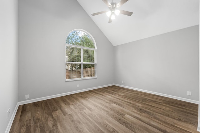 empty room with ceiling fan, hardwood / wood-style floors, and high vaulted ceiling