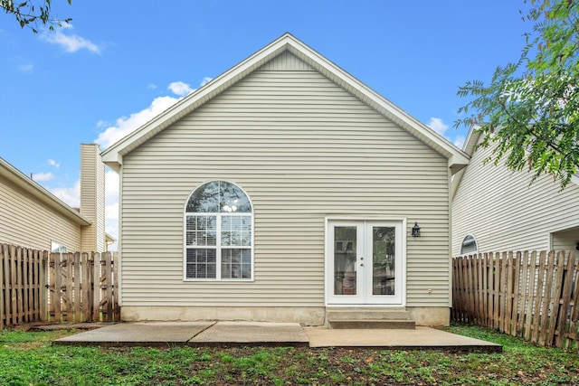 rear view of house with french doors and a patio