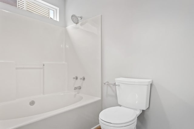 bathroom with toilet and shower / bathtub combination