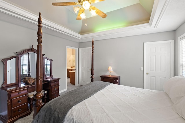 bedroom with ceiling fan, carpet, a tray ceiling, and multiple windows