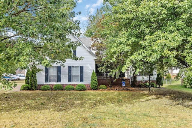 view of side of home featuring a lawn